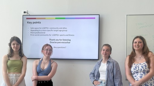 Students giving a presentation using a screen