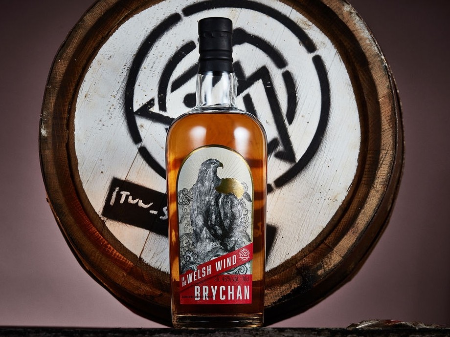 A bottle of Brychan whisky with a celtic design in the background