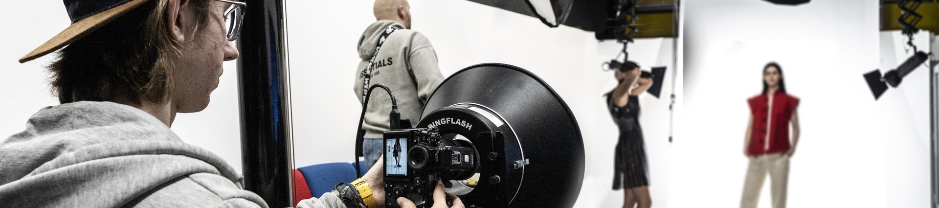 A fashion student takes part in a photoshoot. 