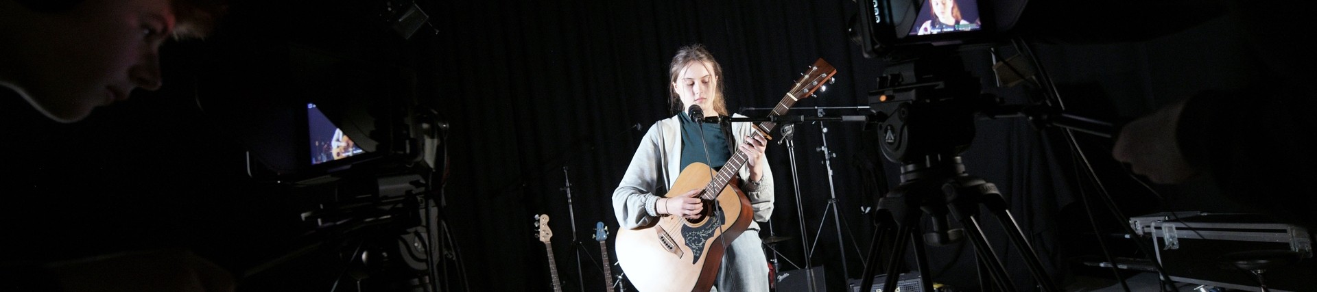 A student performs her own composition. 