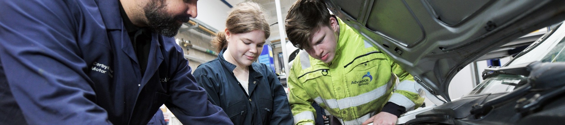 Students working on a car.