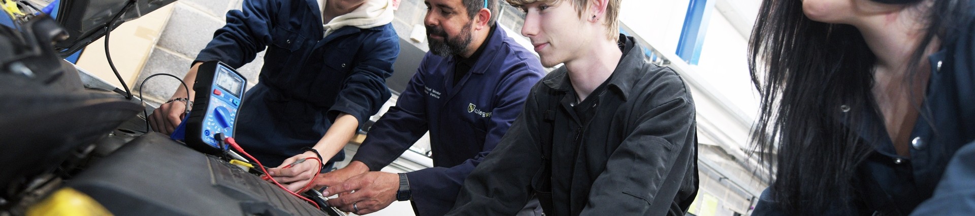 Students working on a car.