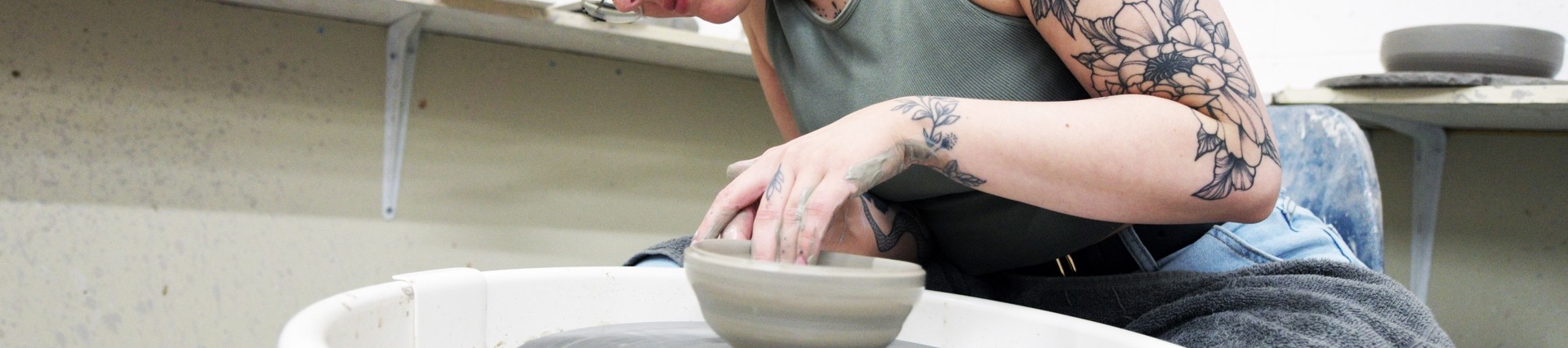 A student works on some pottery.