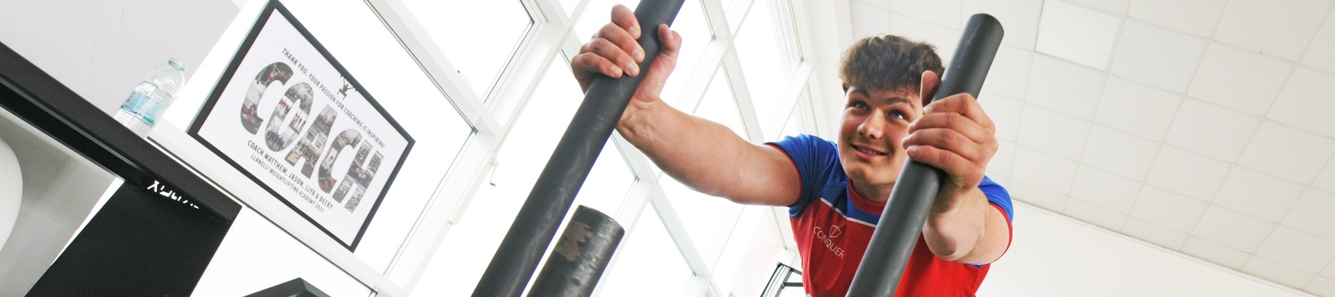 A student working out in the gym.