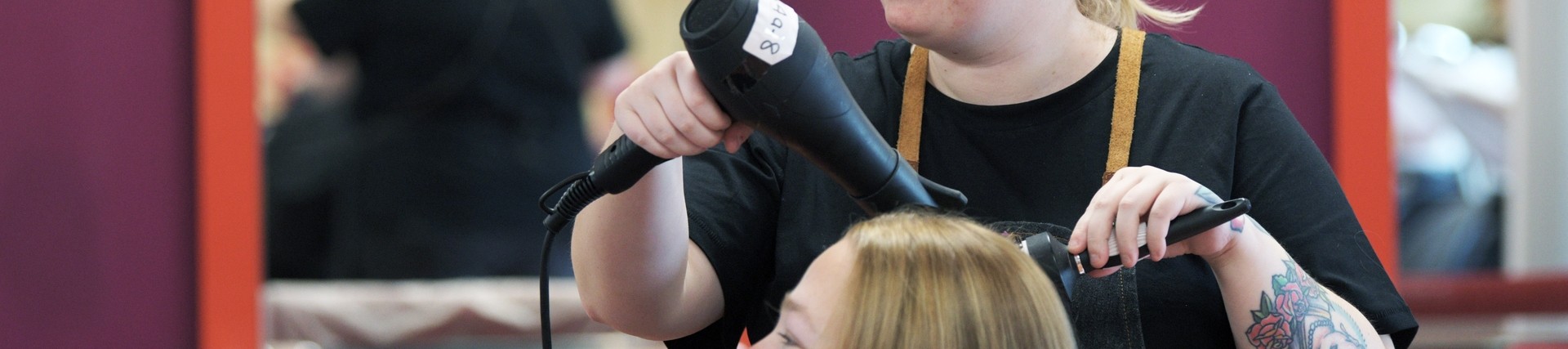 A student using a blowdryer.