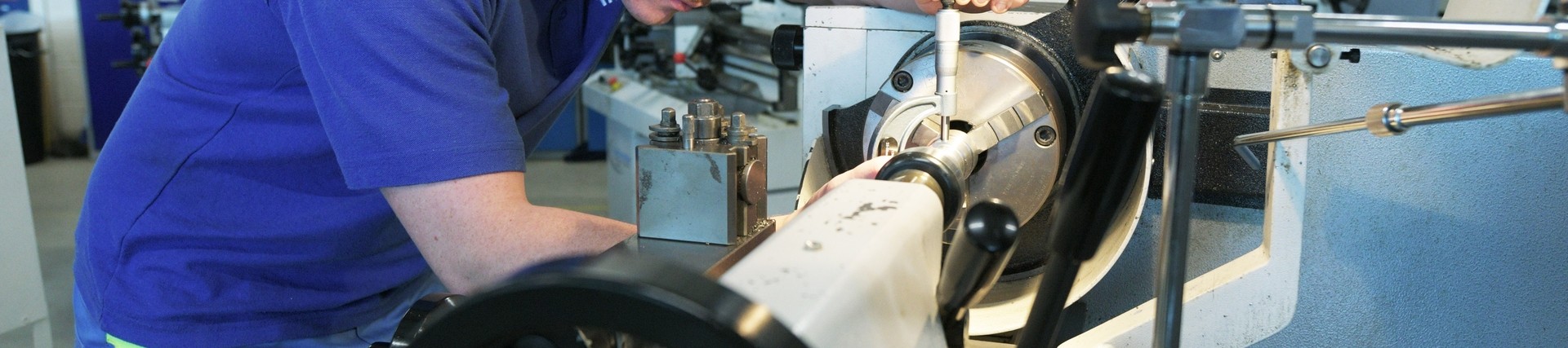 A student using a lathe.