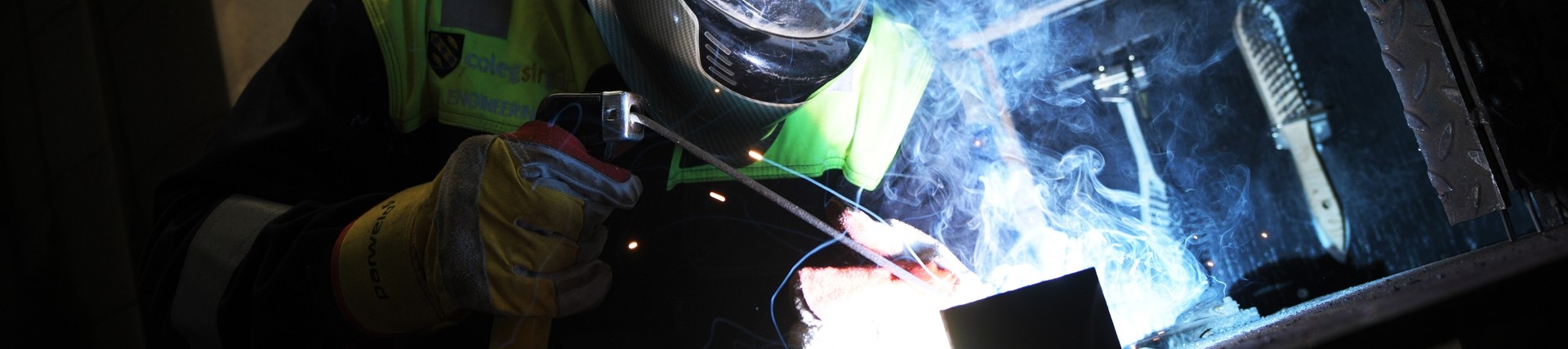 A student welding. 