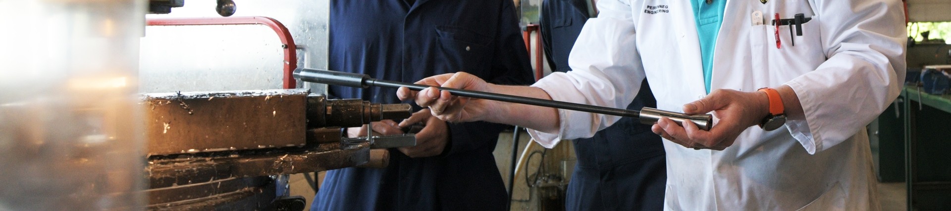  A lecturer demonstrating his metalwork skills.