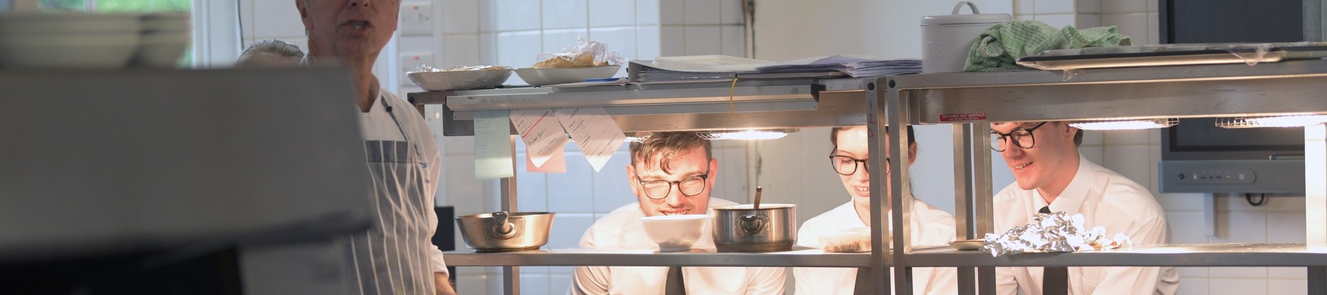 Students gather in the kitchen.