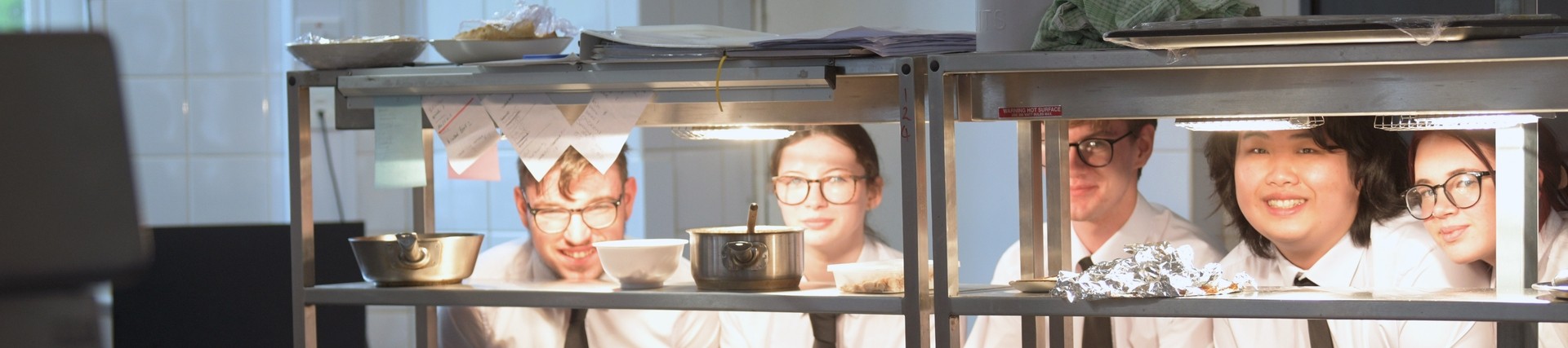 Students gather in the kitchen.