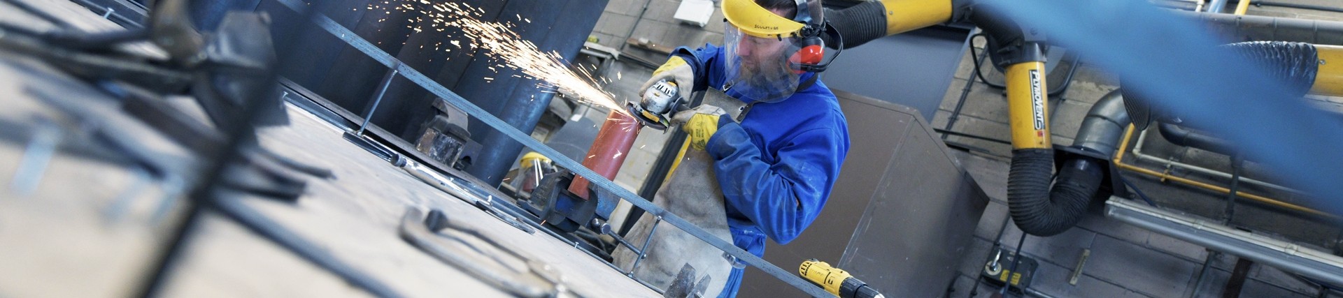 A student uses a grinder. 