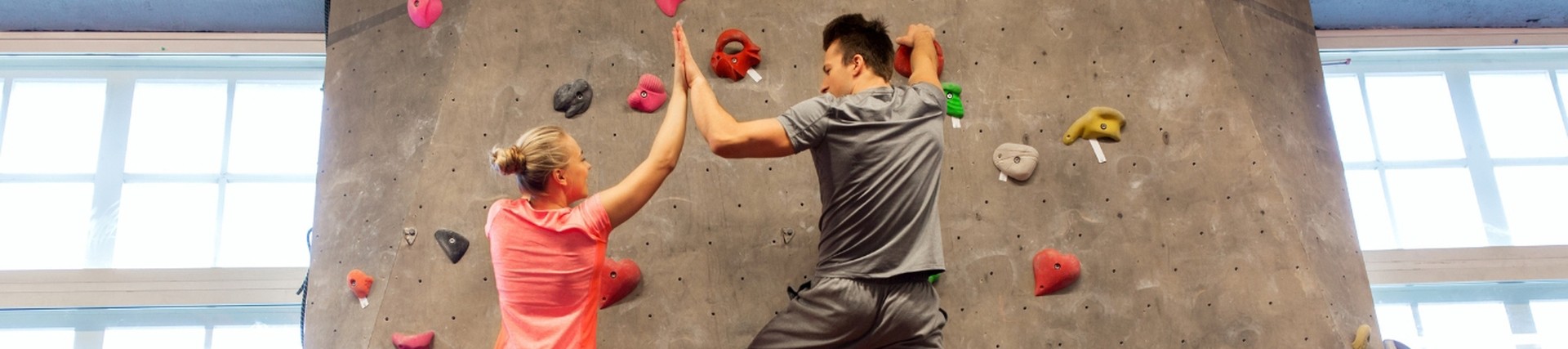 Two students on a climbing wall