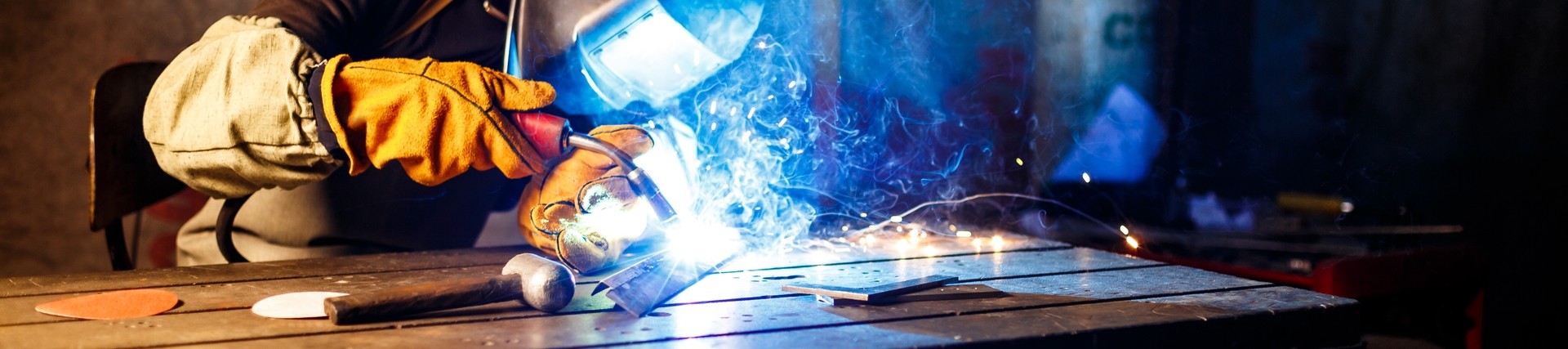 Student welding in full PPE