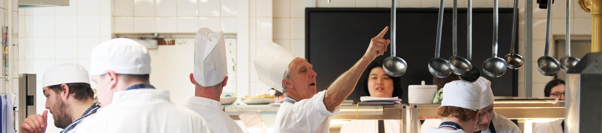 Student chefs in white uniforms