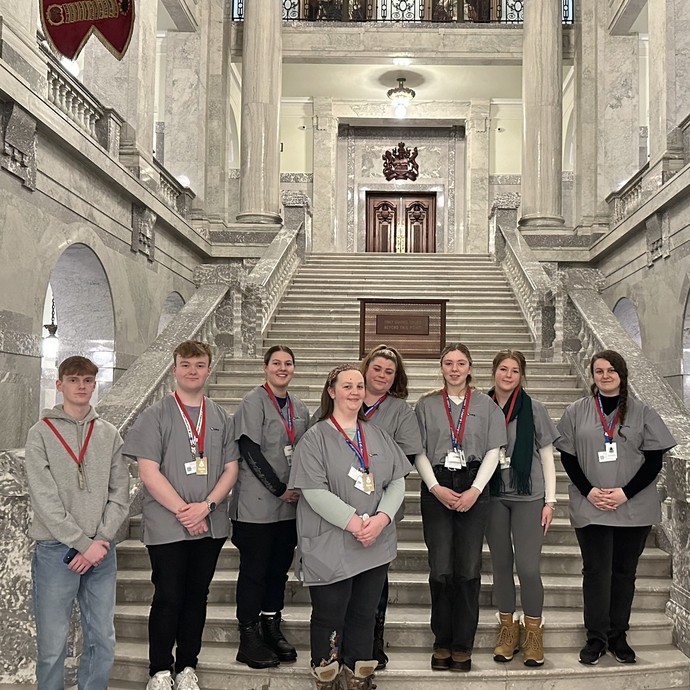Students standing on stairs of a Government building in Alberts