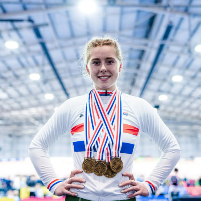 Emma Finucane with multiple olympic medals around her neck